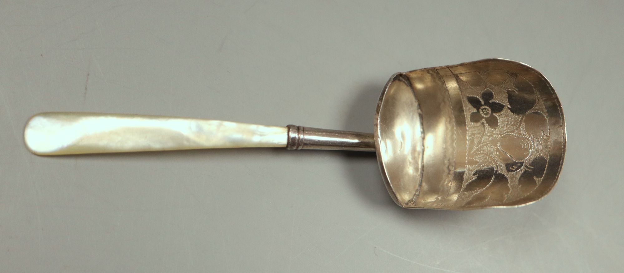 A George III mother of pearl handled silver caddy spoon, Joseph Taylor, Birmingham, 1817, 99mm.